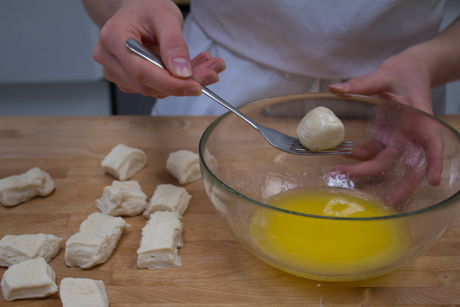 18. Dip dough pieces in butter