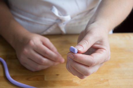 14. To make a little tea cup start with a small log and flatten each side. Using a cake-pop stick gently poke a little hole in one end of the cup. Set aside.