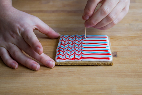 Using a toothpick to marble royal icing