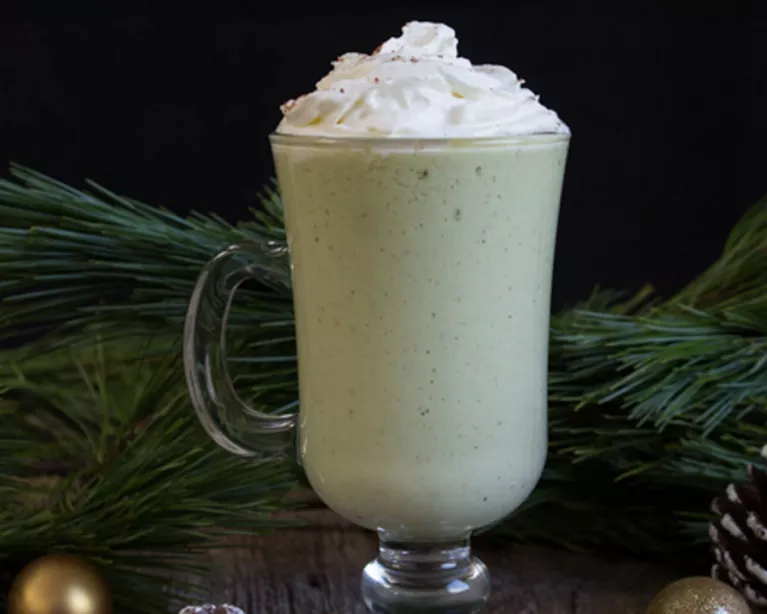 Mug of eggless eggnog topped with whipped cream