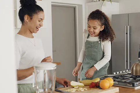 A mother and daughter baking together